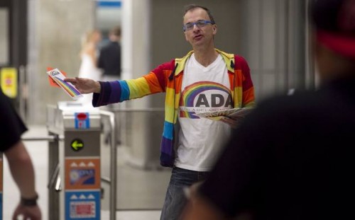 Héctor Gomez hands out pamphlets at the Berru-UQUAM metro station in Montreal. He heads a support group that he founded, called Beyond the Rainbow, that reaches out to gay and lesbian immigrants