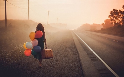 woman balloons walking
