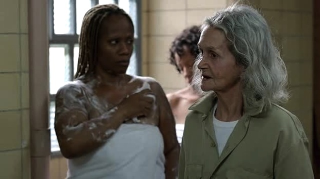 The woman in the background has just been given very stern advice about not dropping the soap