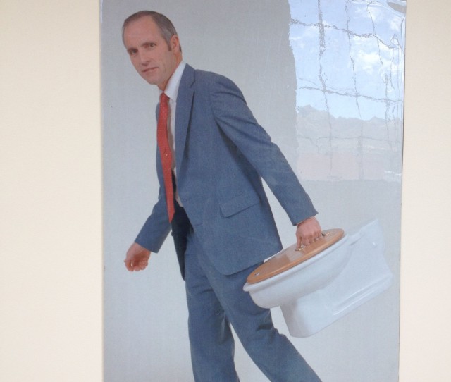Photo of a Young Don Aslett carrying his toilet briefcase.