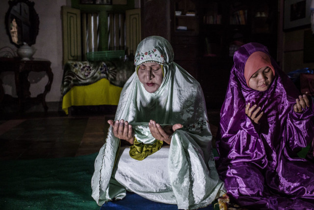 YOGYAKARTA, INDONESIA - JULY 08: Shinta Ratri, a leader of a Pesantren boarding school, Al-Fatah, for transgender people known as 'waria' prays during Ramadan on July 08, 2015 in Yogyakarta, Indonesia. During the holy month of Ramadan the 'waria' community gather to break the fast and pray together. 'Waria' is a term derived from the words 'wanita' (woman) and 'pria' (man). The Koran school Al-Fatah was set back last year's by Shinta Ratri at her house as a place for waria to pray, after their first founder Maryani died. The school operates every Sunday. Islam strictly segregates men from women when praying, leaving no-where for 'the third sex' waria to pray before now. (Photo by Ulet Ifansasti/Getty Images)