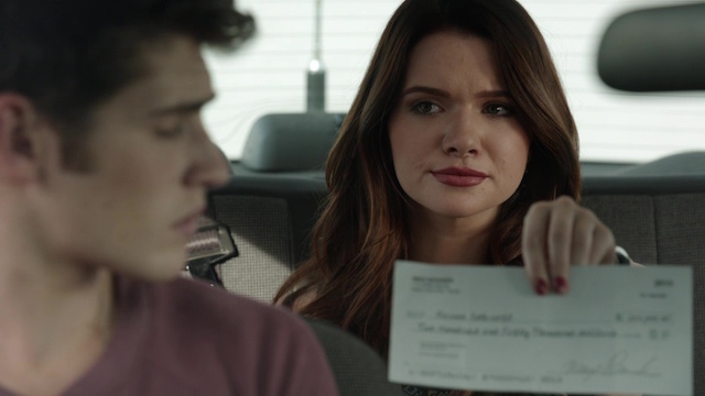 Here. It's a check. It's larger than other checks.