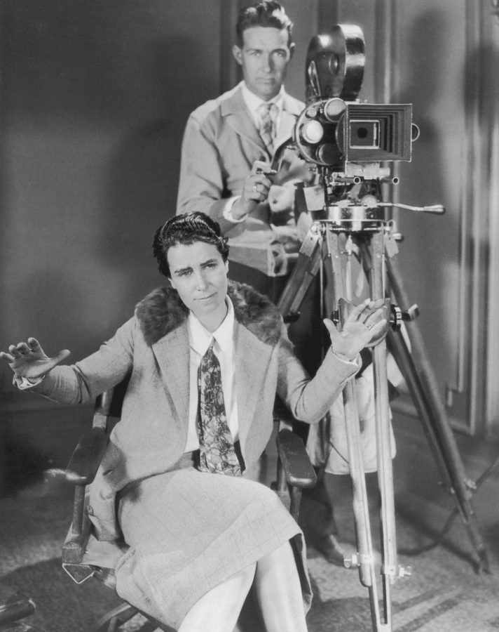 ilm director Dorothy Arzner (1897-1979) pictured on directing 'Fashions For Women', USA, circa 1927. A man operating a camera is seen behind Arzner. (Photo by Archive Photos/Getty Images)