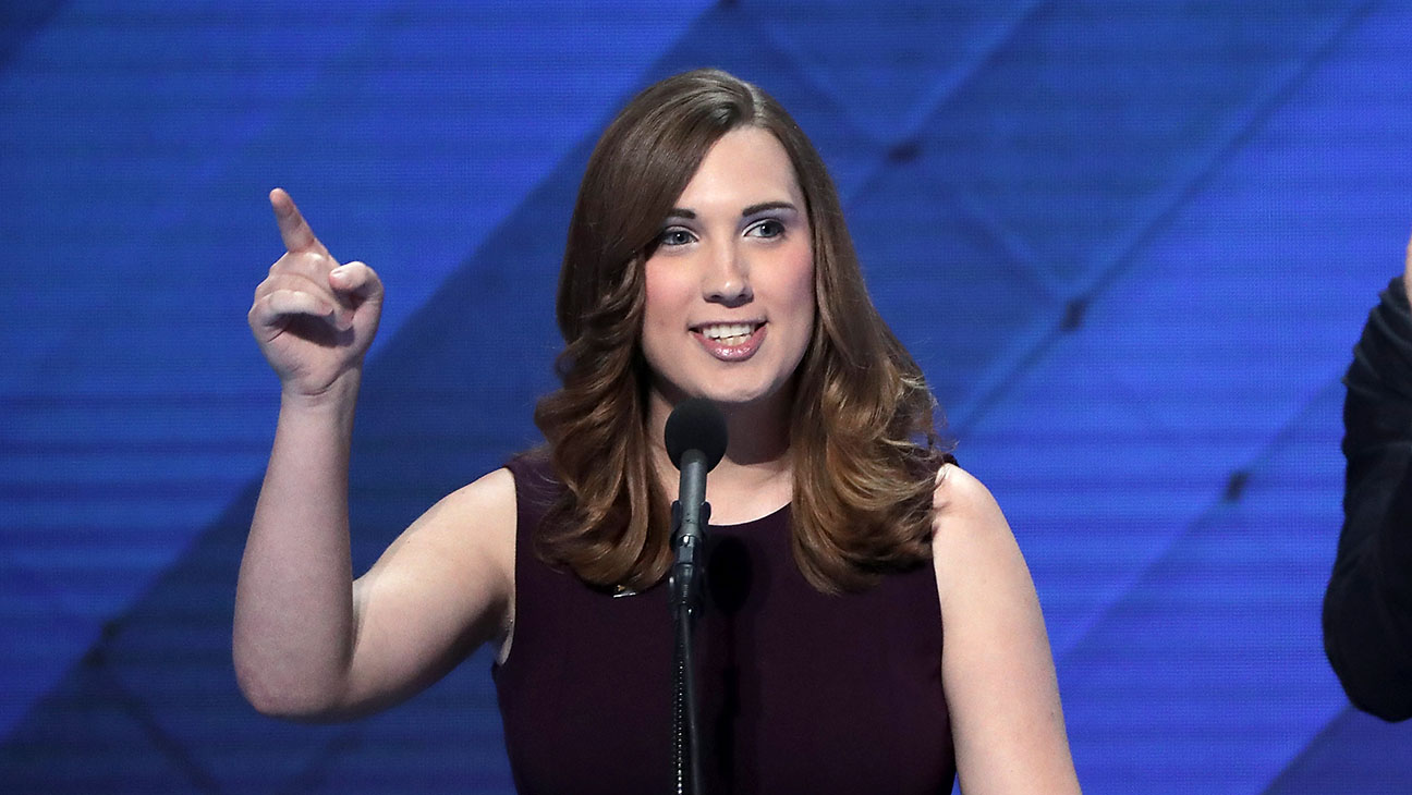 LGBT rights activist Sarah McBride delivers remarks as Co-Chair of the Congressional LGBT Equality Caucus Congressman Sean Patrick Maloney looks on during the fourth day of the Democratic National Convention at the Wells Fargo Center, July 28, 2016 in Philadelphia, Pennsylvania. Democratic presidential candidate Hillary Clinton received the number of votes needed to secure the party's nomination. An estimated 50,000 people are expected in Philadelphia, including hundreds of protesters and members of the media. The four-day Democratic National Convention kicked off July 25.