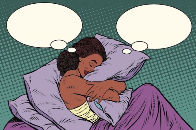 Young woman in bed hugging a pillow