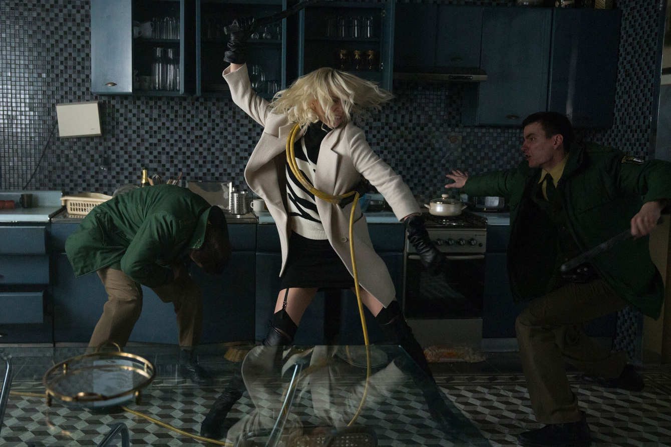 Every Coat Worn By Charlize Theron in “Atomic Blonde,” Ranked