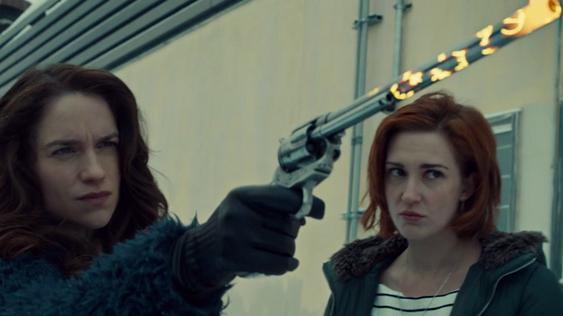 Wyonnna aims Peacemaker while Nicole watches, a little worried