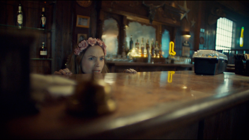 Waverly peeps out from behind the bar