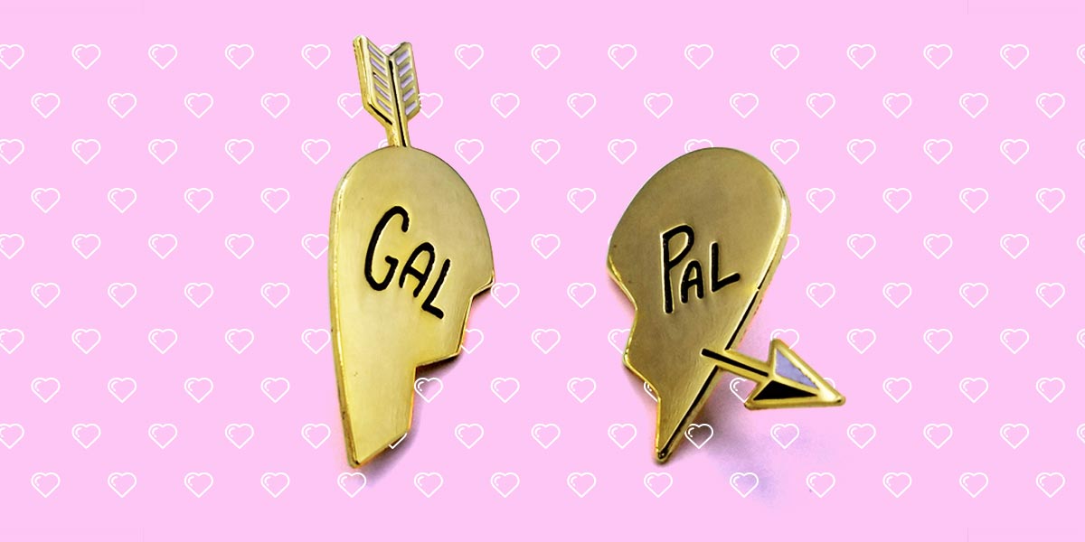 autostraddle merch gal pal enamel pin set gold heart halves that say 