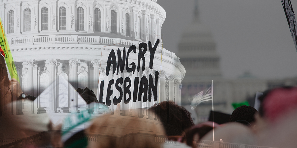 A protest sign reads 