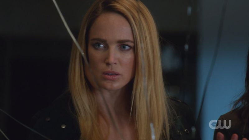 Sara looks into the broken mirror