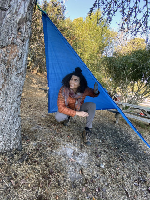 abeni in her makeshift rain shelter