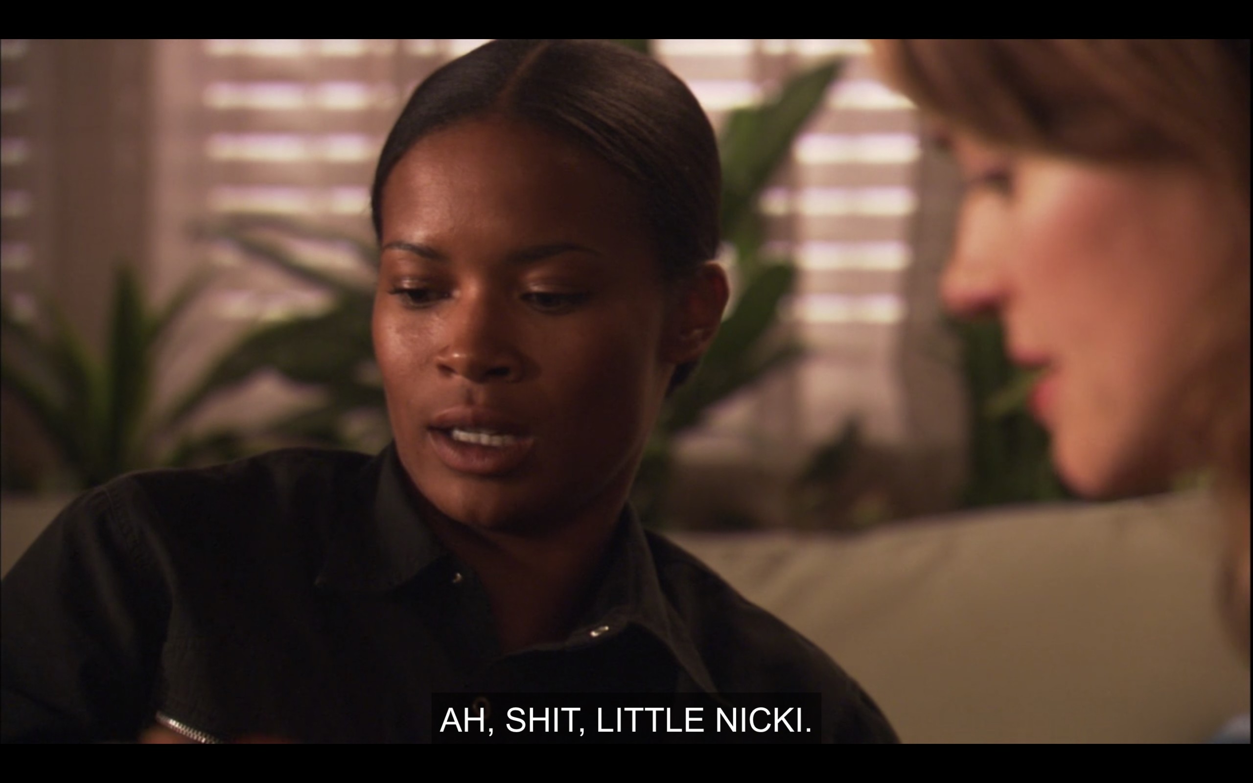 Tasha (wearing a black shirt) sitting with Alice in her apartment. "Ah, shit, little Nicki."