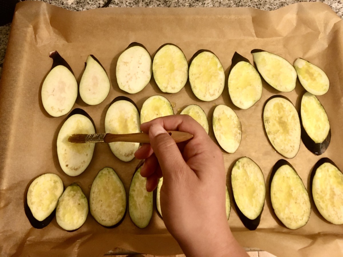 round slices of eggplant on a sheet pan 