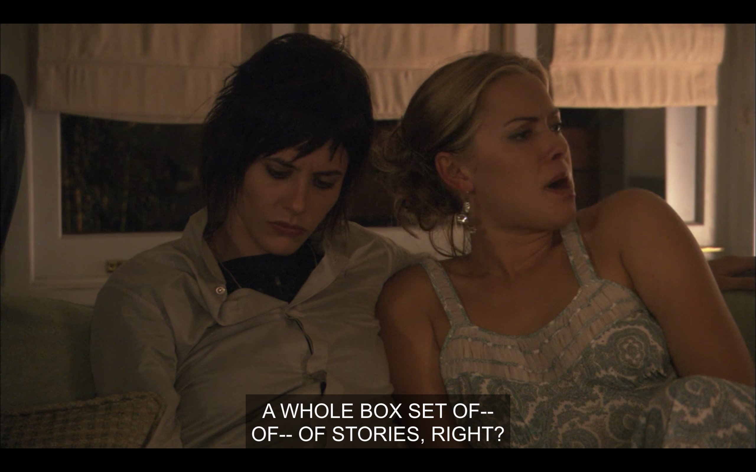 Shane sits with her arm around Paige on the couch. Shane says, "A whole box set of -- of -- of stories, right?"