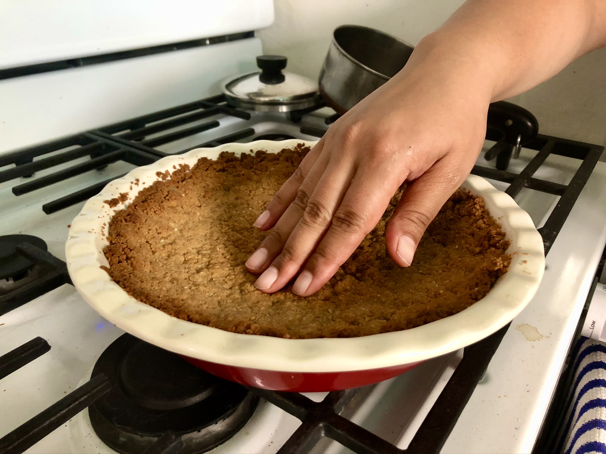 golden hand on a baked golden cookie crust