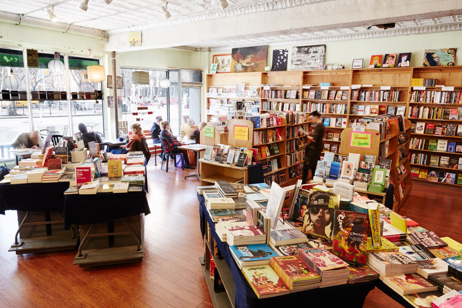 A wide angle photo of the inside of Bluestockings bookstore and activist center.