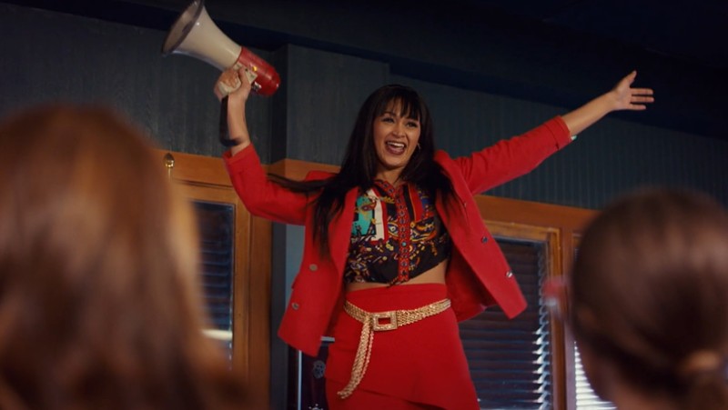 cleo throws her hands up in the air