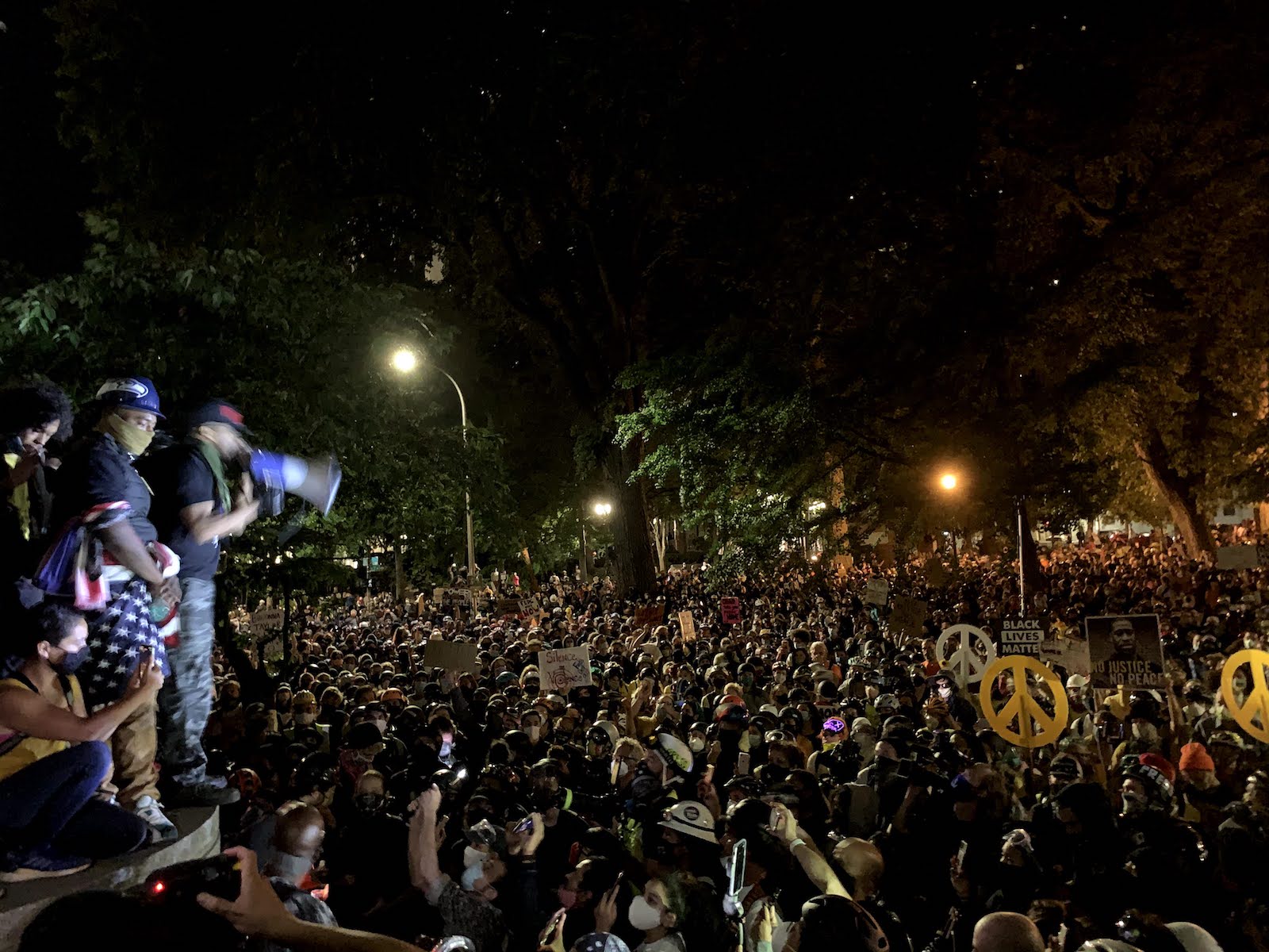 Activist and We Out Here founder Mac Smiff addresses thousands of protesters outside of the Portland Police Bureau headquarters on July 22.