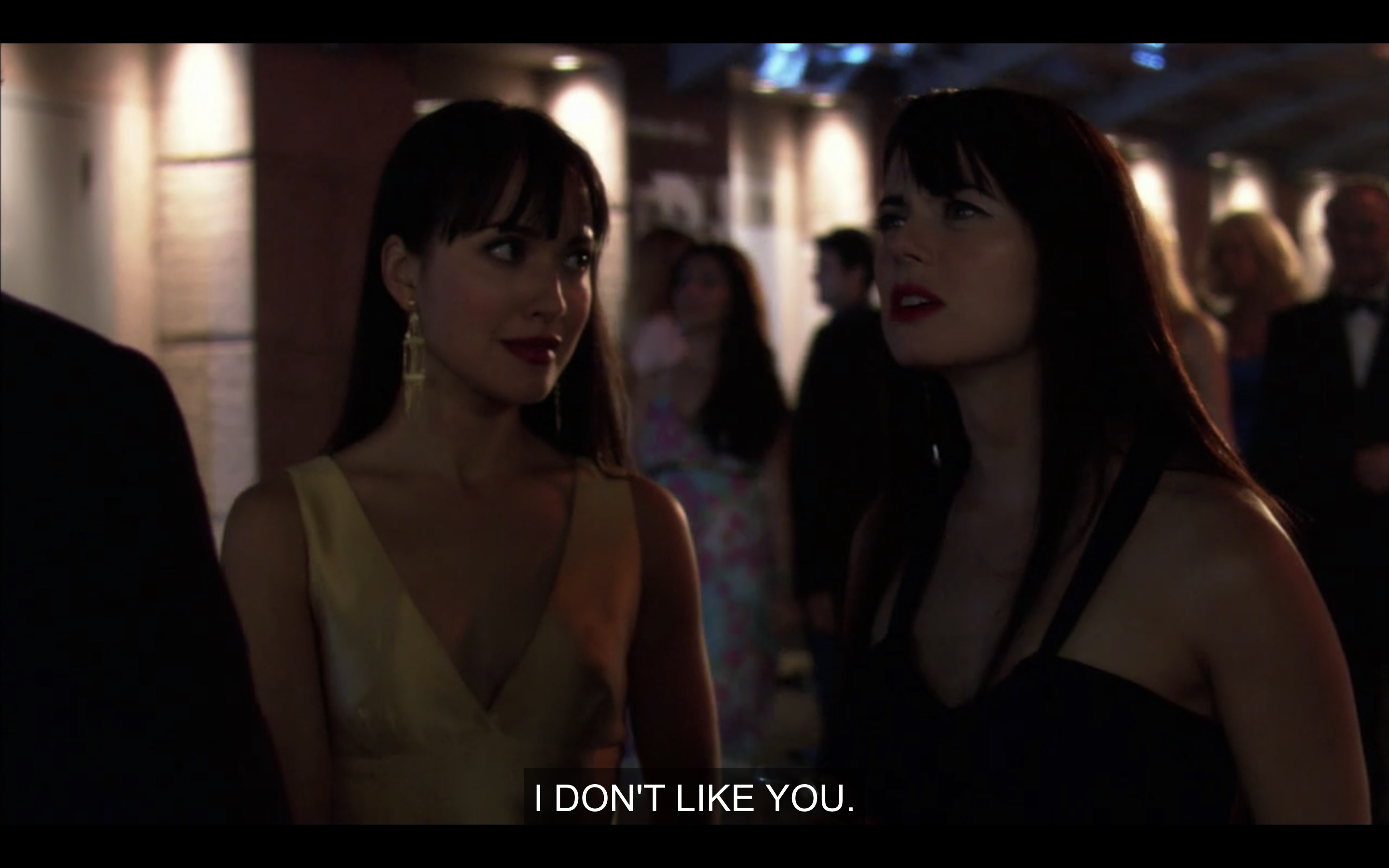 Jenny and Adele talk to security outside of the "Liquid Heat" premiere.