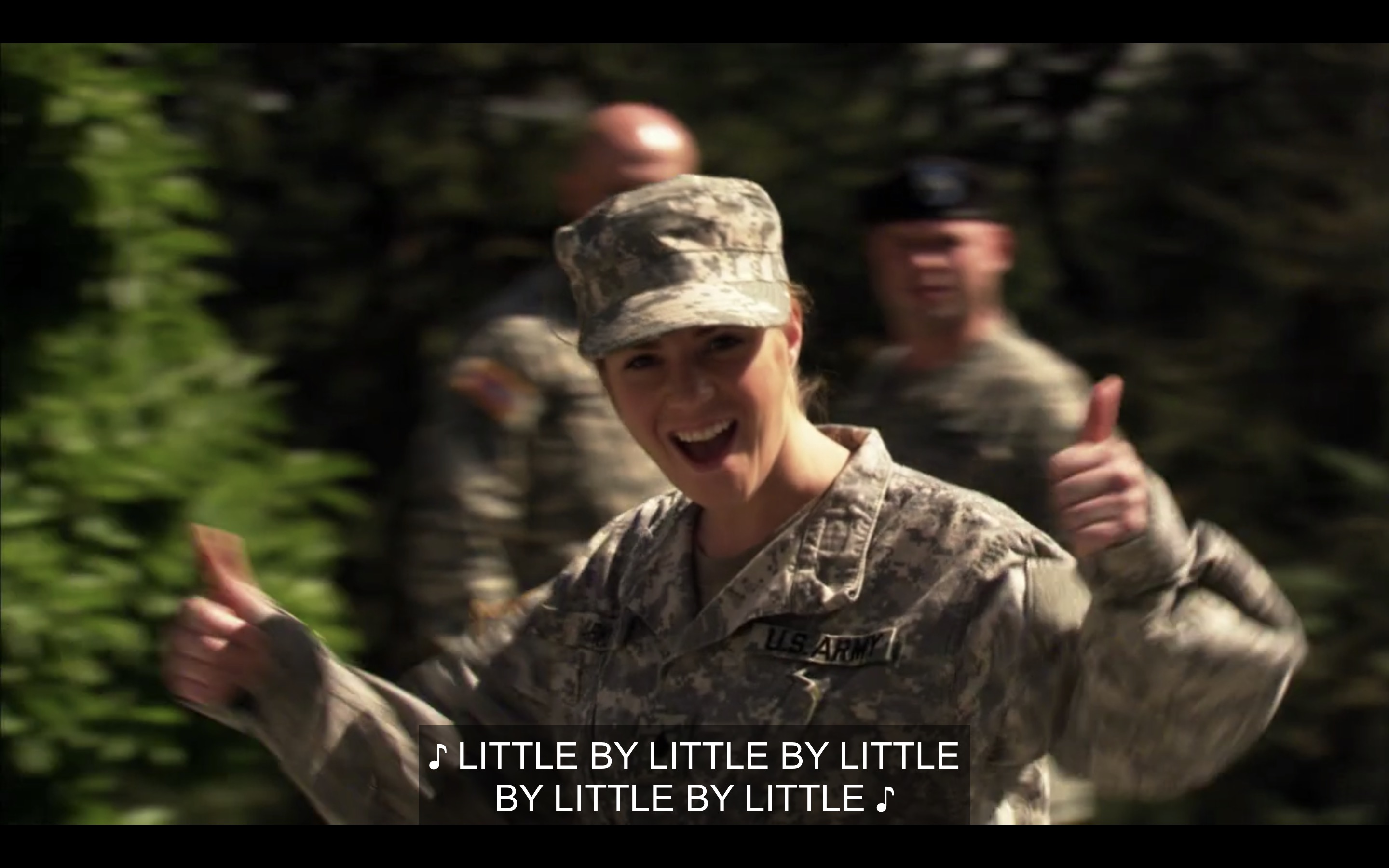 Soldier gives two thumbs up to Tasha and Alice