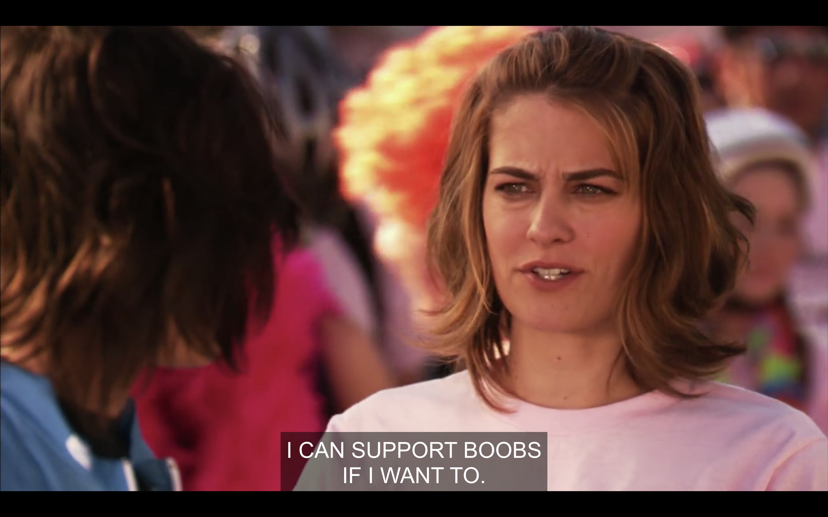 Molly in a pink t-shirt, saying "I can support boobs if I want to"