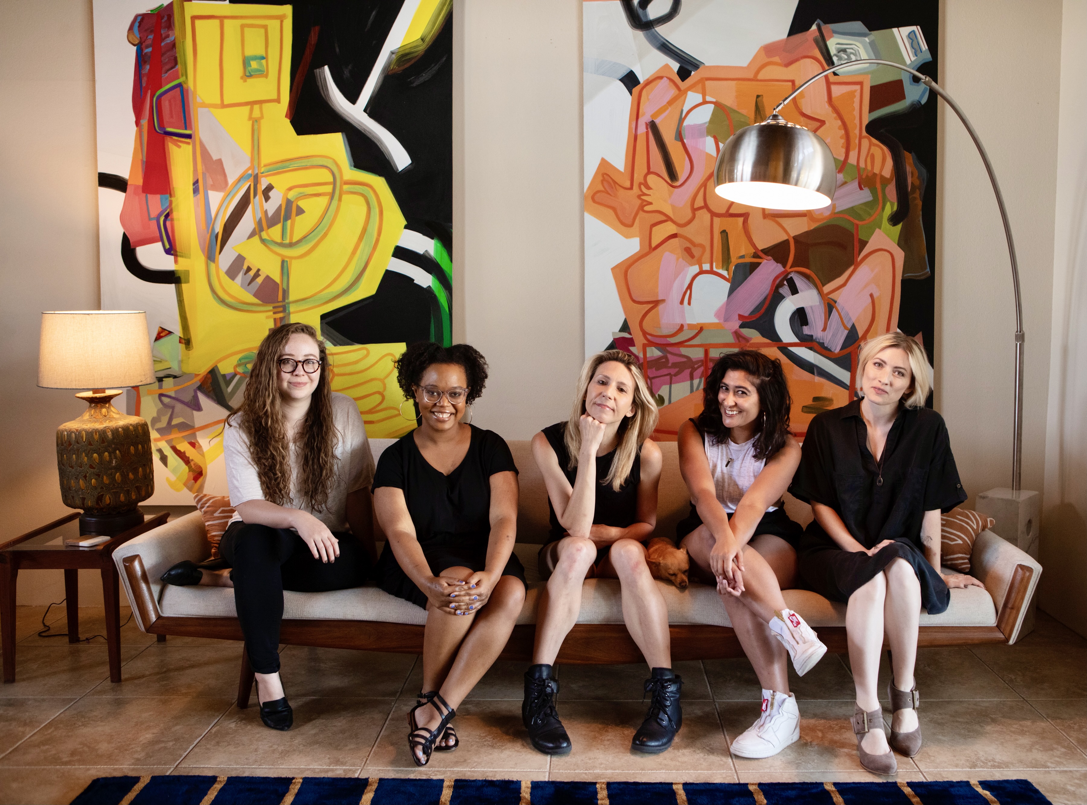 Sitting on a couch together, left to right: Rachel, Carmen, Riese, Sarah, and Laneia