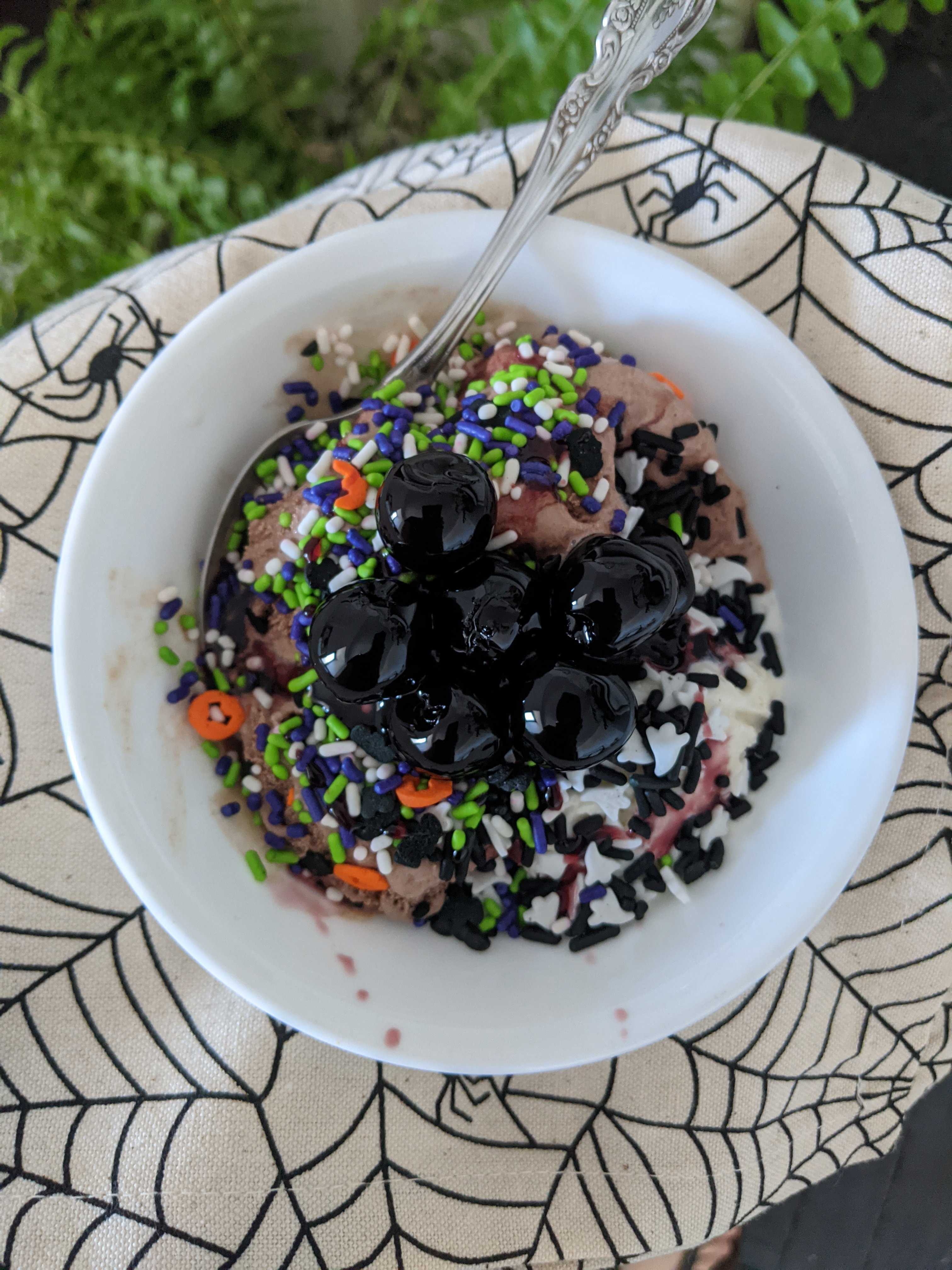 an ice cream sundae with halloween sprinkles