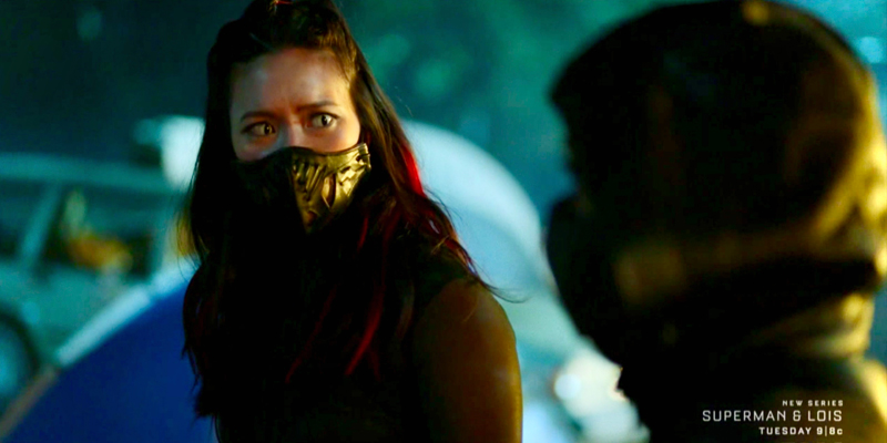 Grace Choi is prepared for a fight, she's disguised herself with red hair and green cat eyes and an inordinate black mask.