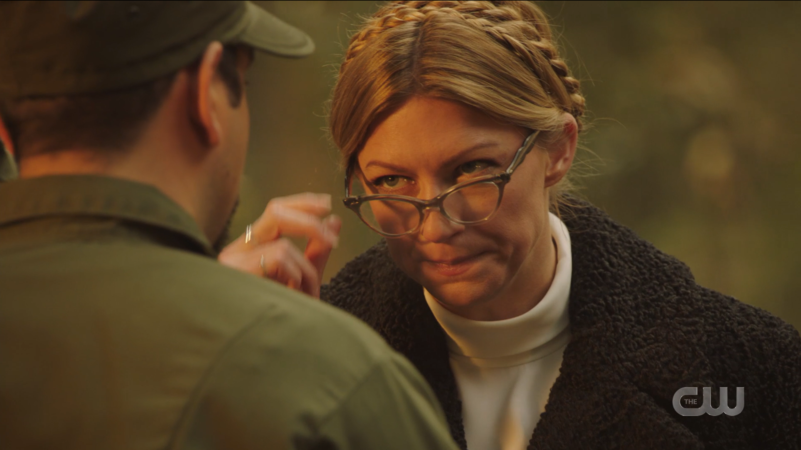 Legends of Tomorrow Episode 604: Ava looks down her costume glasses at a soldier.