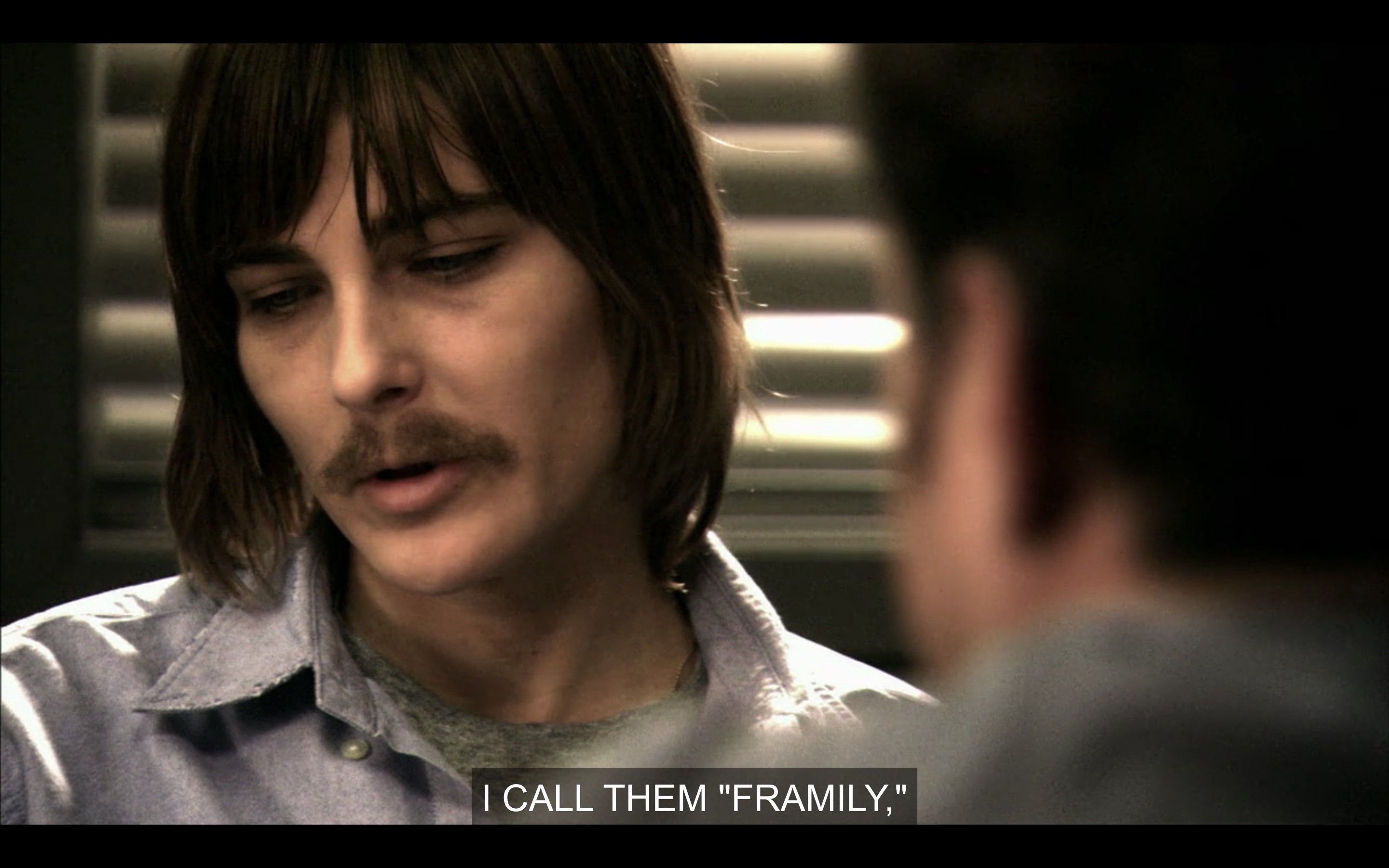 Max is saying "I call them 'framily'" in the interrogation room with his moustache