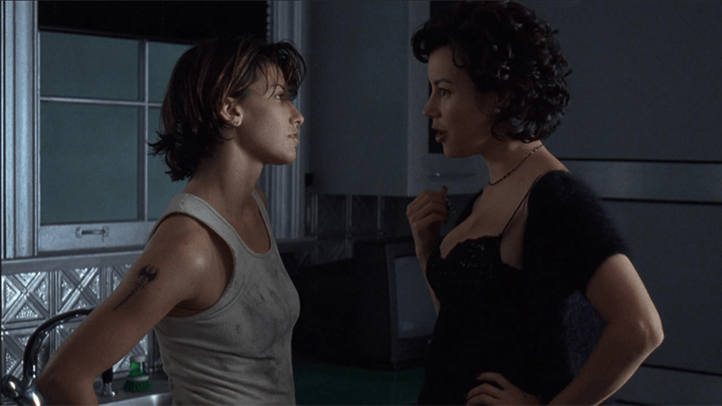 Corky and Violet stare at each other, sweatily
