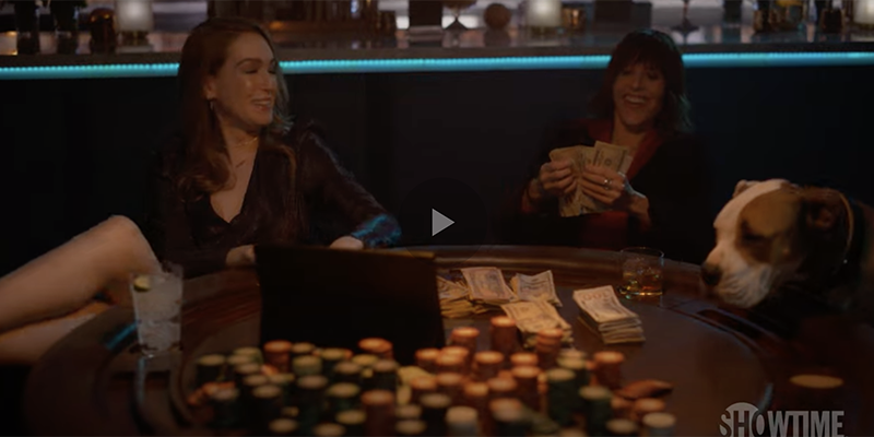 Tess and Shane counting their poker earnings at Dana with a puppy overlooking