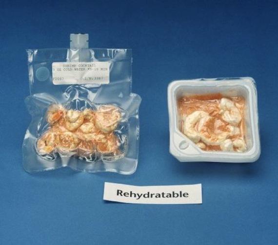 Two plastic packages of freeze dried shrimp cocktail with a label saying rehydratable