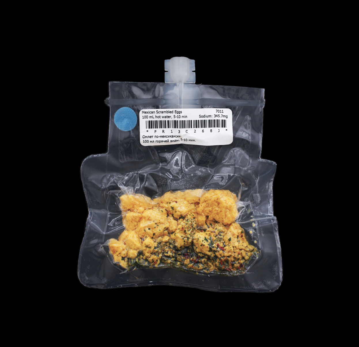 A clear vacuum-packed package of food labeled "Mexican scrambled eggs" for consumption by astronauts