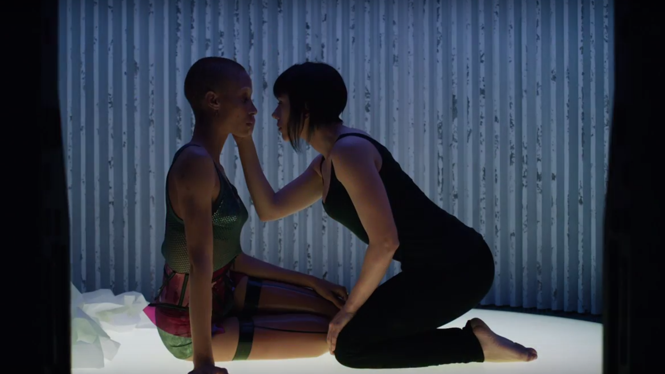 A still from Ghost in the Shell where it looks like two women are about to kiss