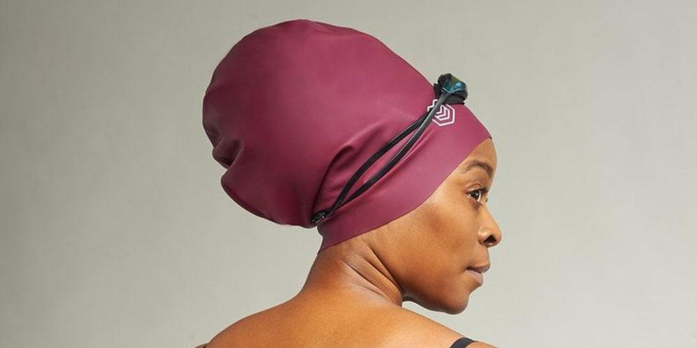 a Black woman wearing a soul cap swimming cap over her hair