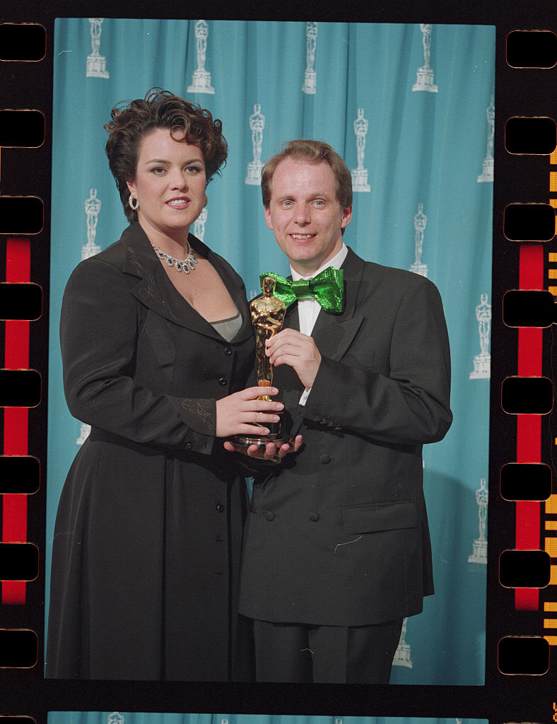Nick Park Holding His Oscar with Presenter Rosie O'Donnell