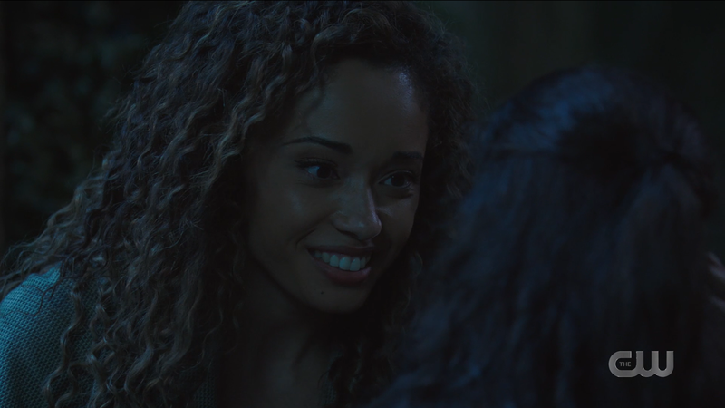 Astra smiles softly and lovingly at little Esperanza