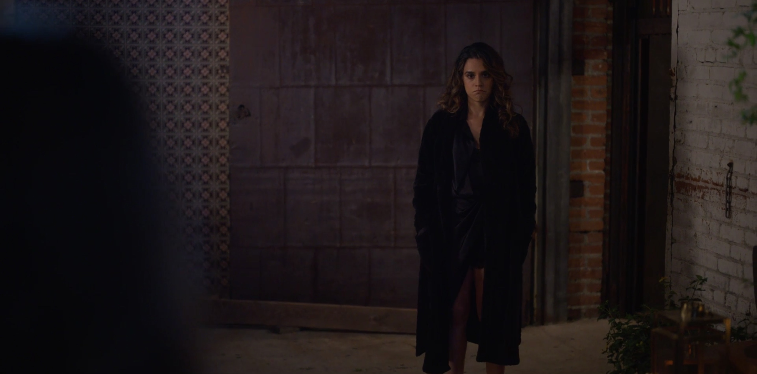 Gigi standing outside in her robe