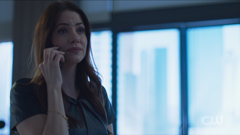 Andrea looks wise as she talks on the phone