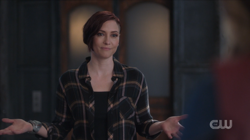 Alex throws her hands up in apology
