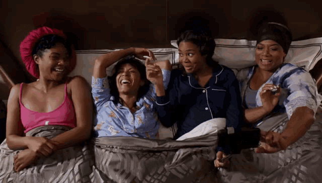 A gif of the cast of girl's trip laughing