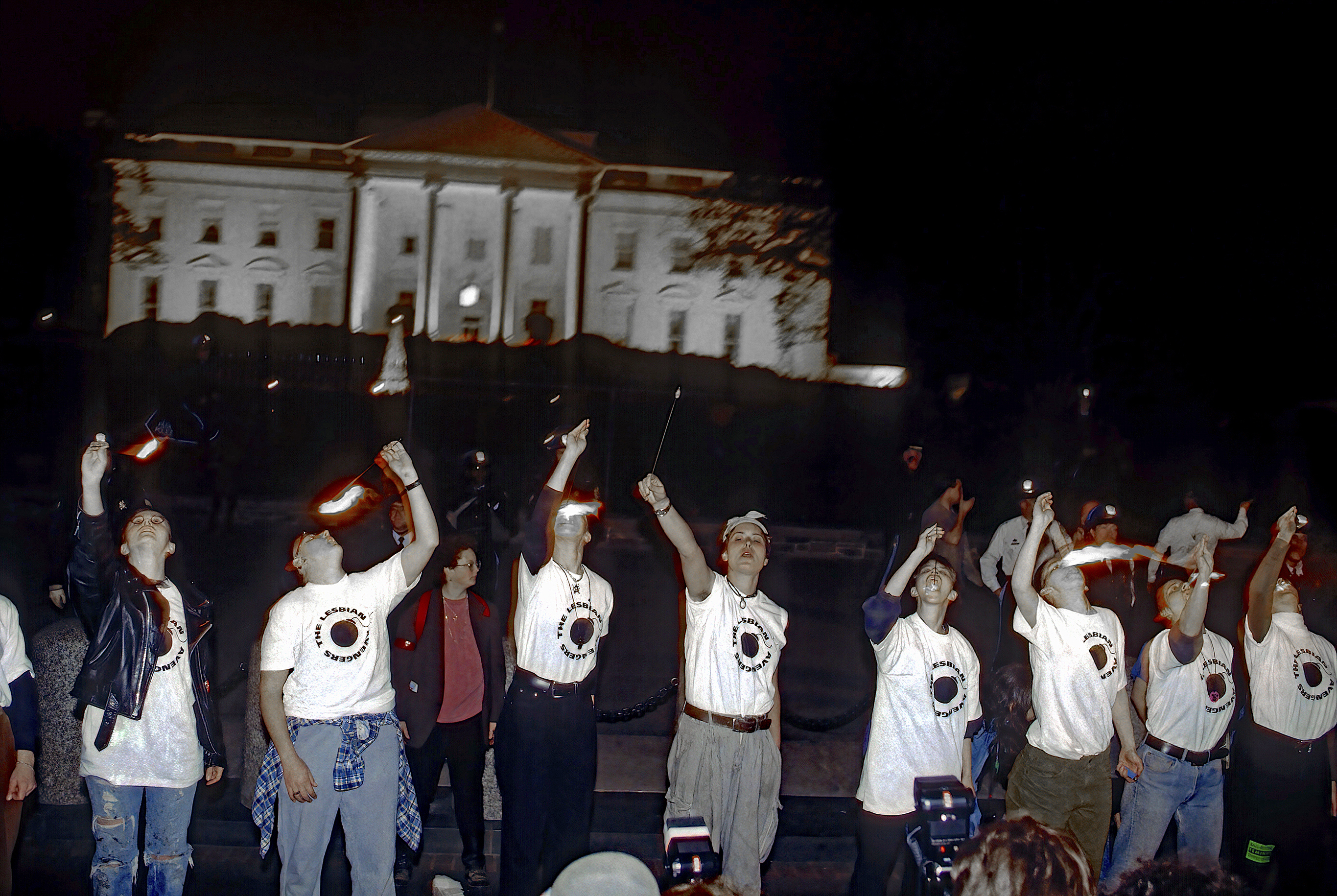 Members of the Lesbian Avengers show off their skill at fire eating during their protest march in front of the White House Washington DC, April 24, 1993 (Photo by Mark Reinstein/Corbis via Getty Images)