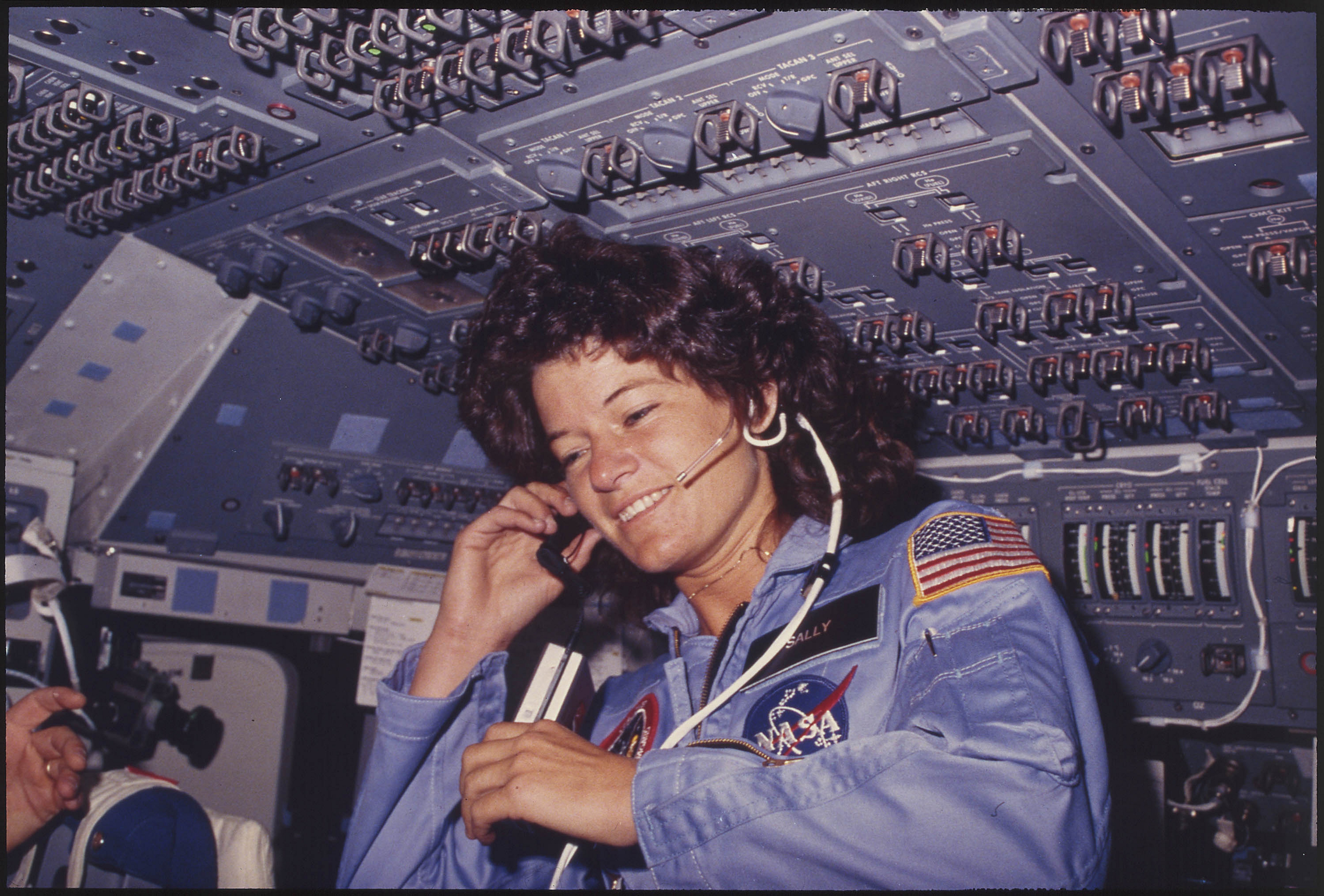 Sally Ride, America's first woman astronaut, communicates with ground controllers from the flight deck during the Challenger mission, June 21, 1983.