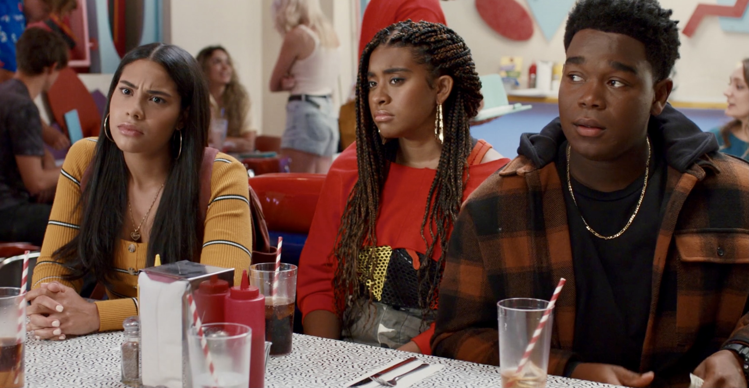 In the Saved by the Bell reboot, Daisy and Aisha, who is bisexual, sit together with their friend.