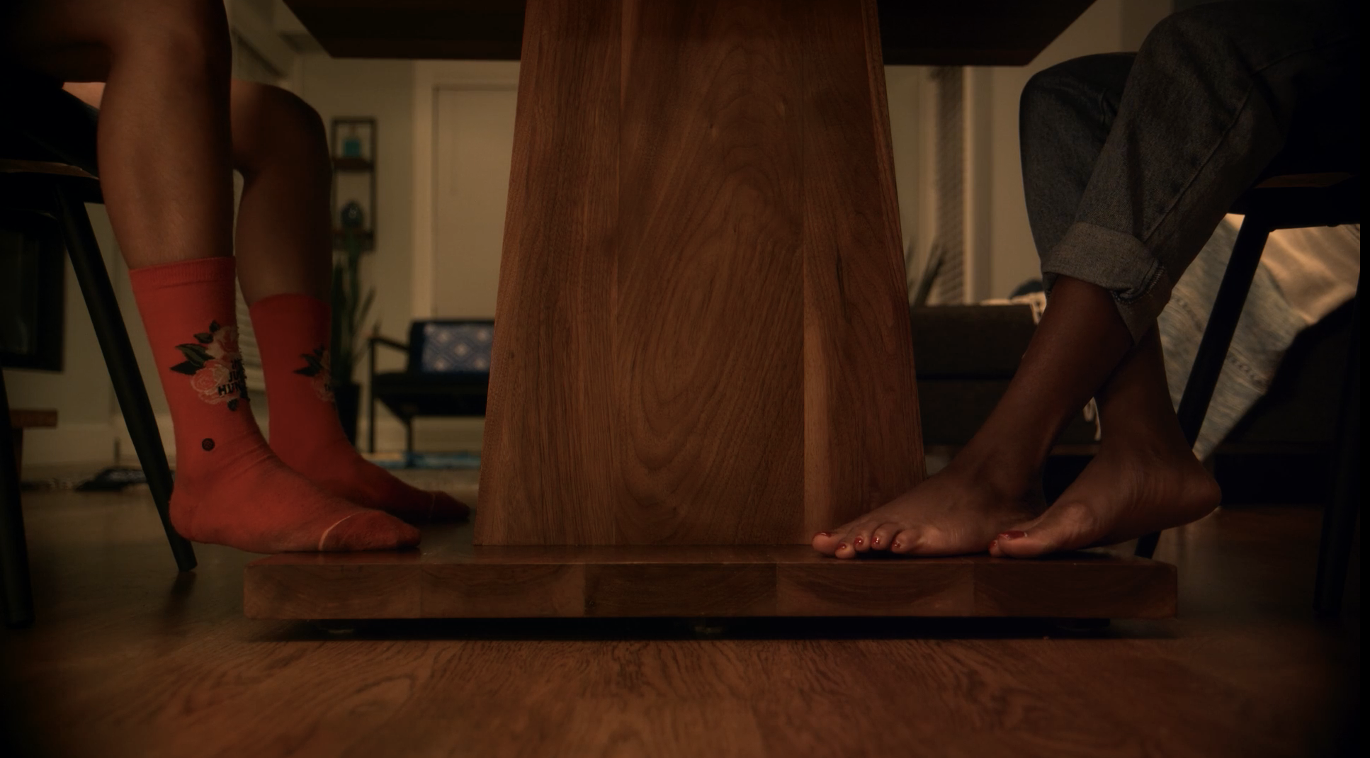 Noor and Layla sit at a table on their first date, all we see is a shot of their feet (with no shoes on) under the table. Queer muslim love