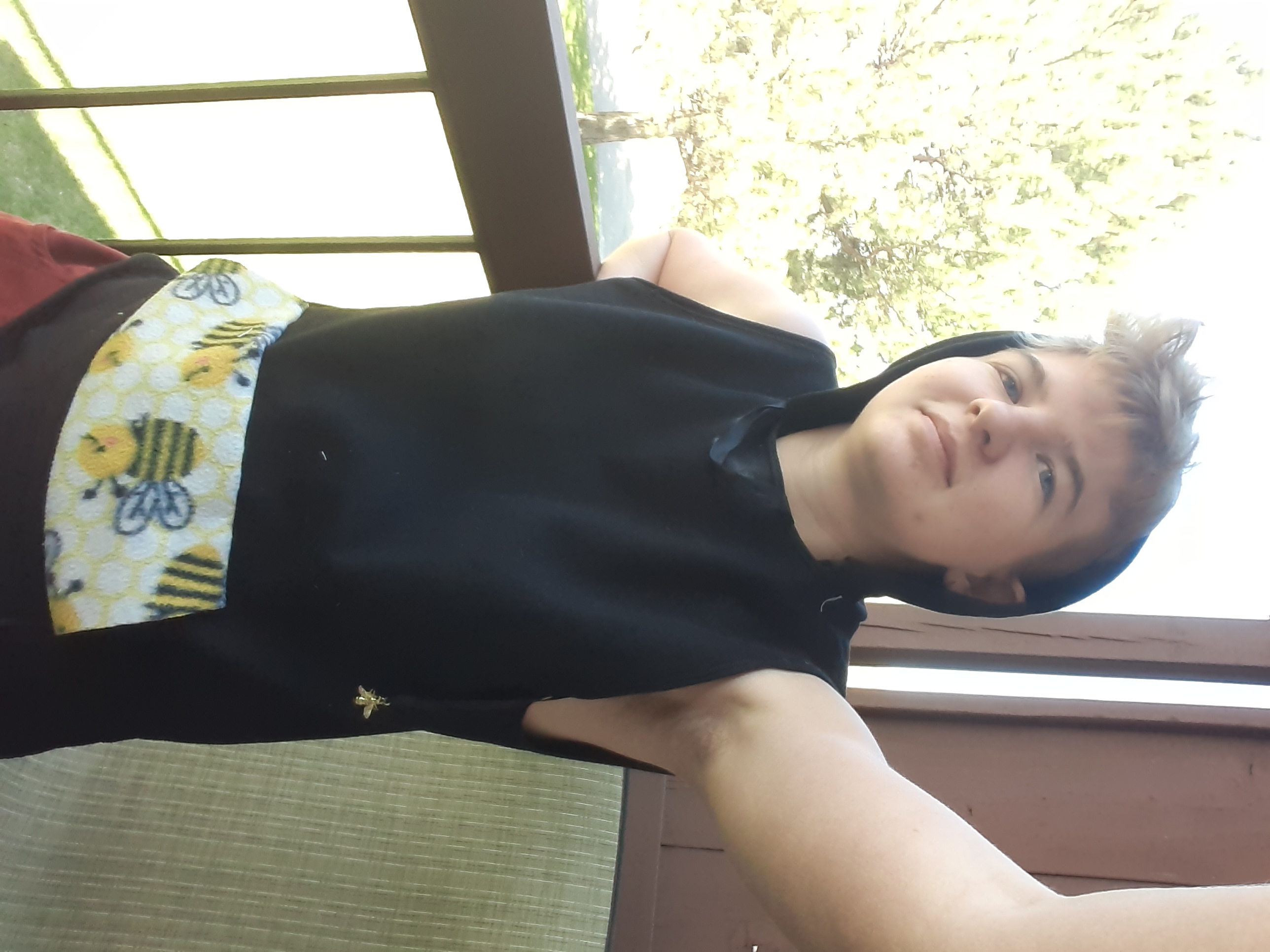 Here is a sleeveless tank modeled by Erin with a bumblebee patterned pocket.