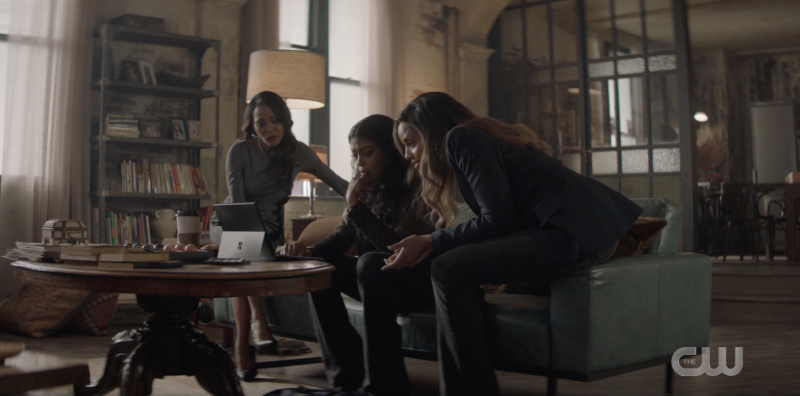 Jada, Ryan, and Sophie sit in the loft looking at Ryan's laptop.