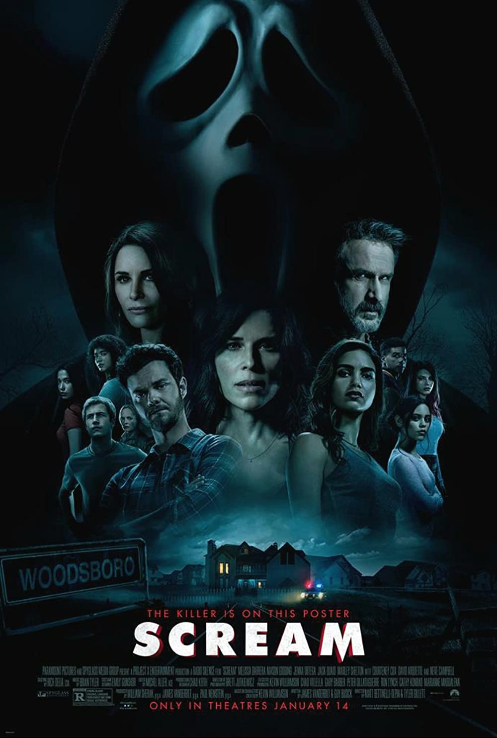 The cover of scream featuring a bunch of people, the iconic scream mask, and Jasmine Savoy Brown